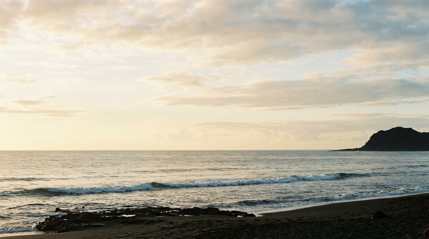 Sunrise over the Pacific from a quiet Hawaiian shoreline.